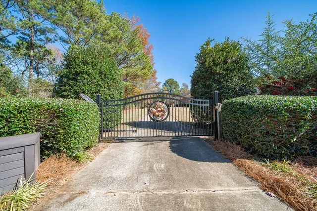 a view of a dining room with furniture a chandelier and wooden floor