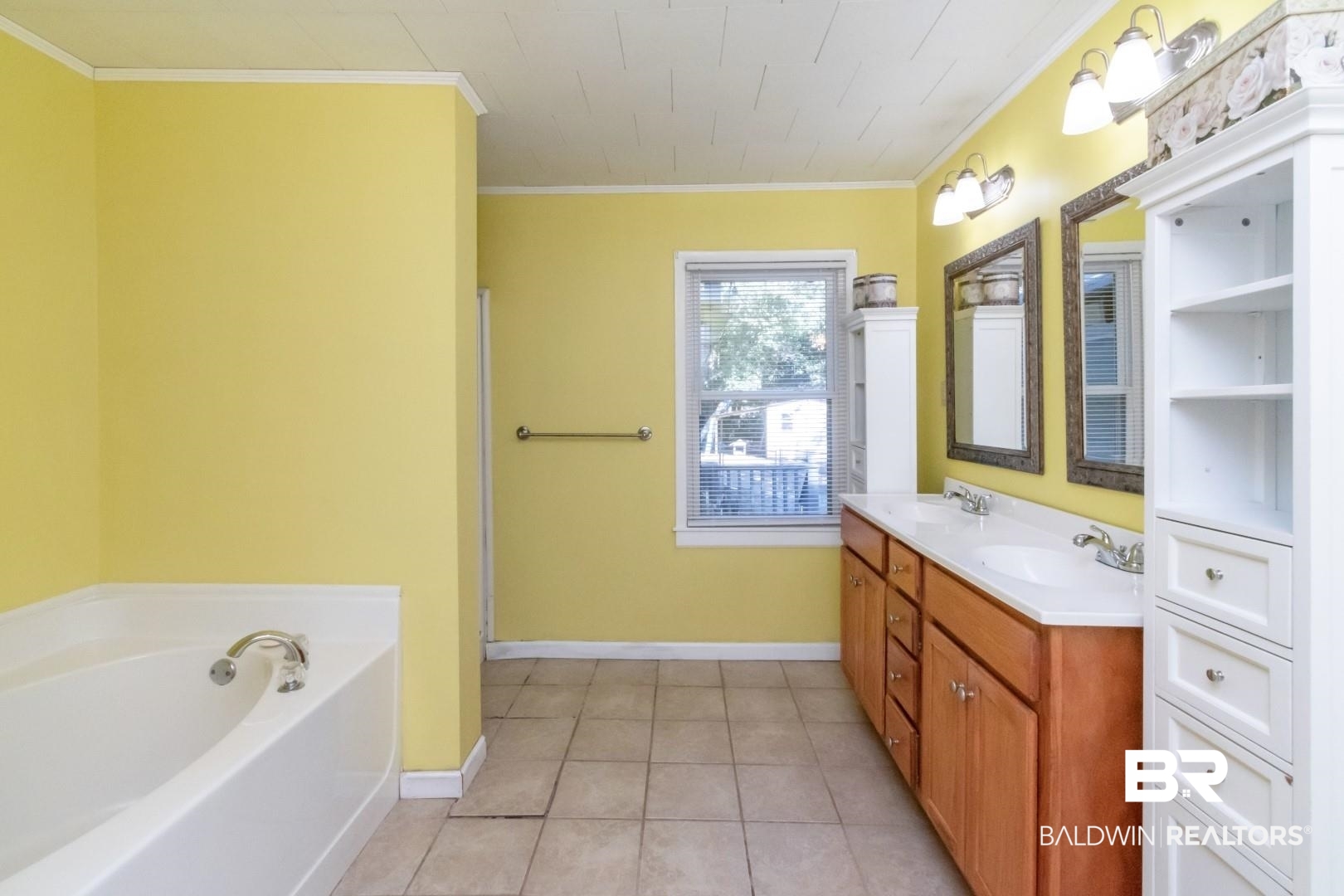 1321 Rainbow Drive West Mobile, AL 36693 - Photo 26 of 48 Bathroom with vanity, ornamental molding, a bath, and tile patterned floors