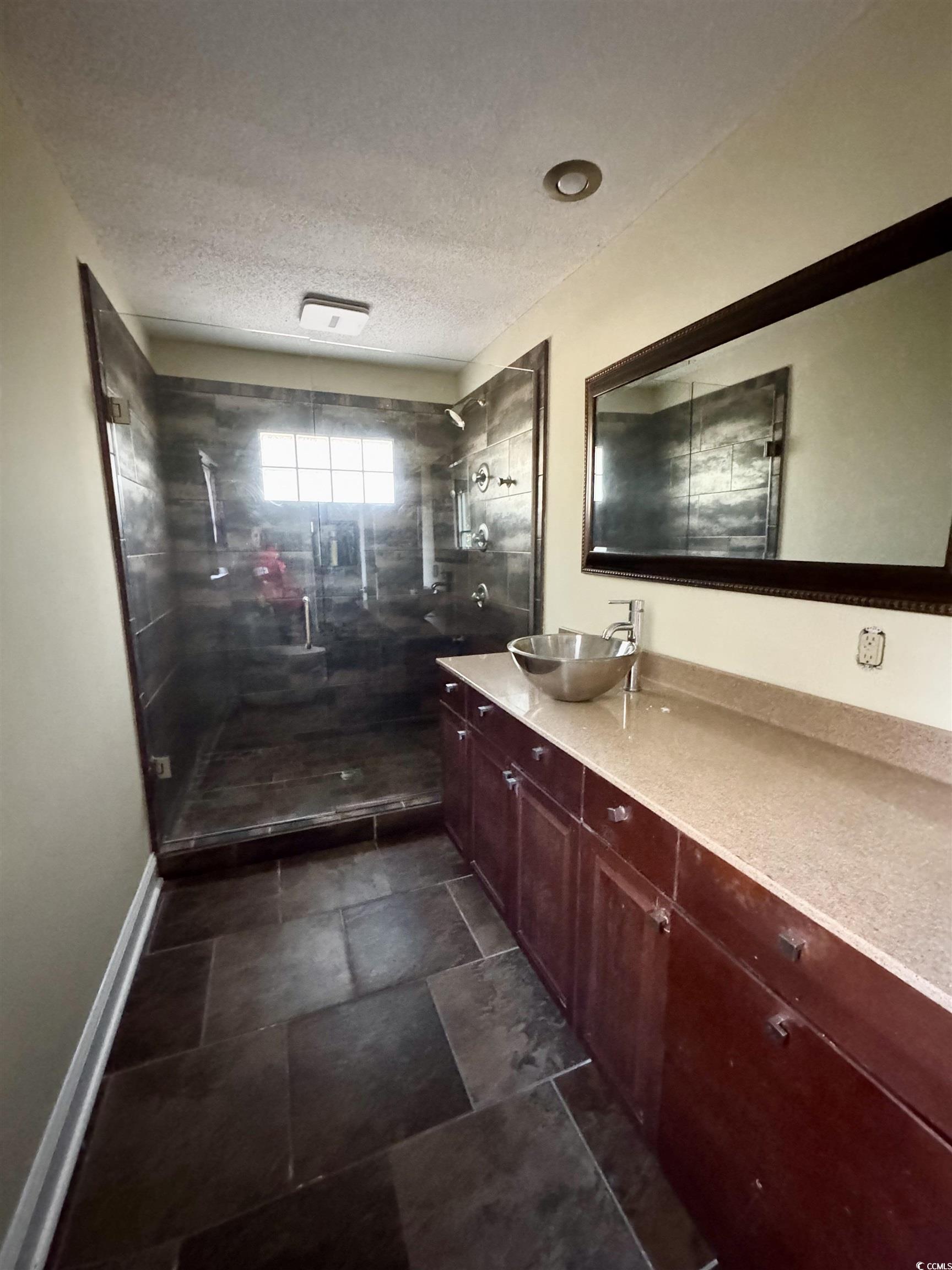932 Duke Street Georgetown, SC 29440 - Photo 26 of 30 Full bathroom with a shower stall, a textured ceiling, and vanity