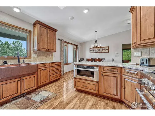 a living room with furniture and a dining table