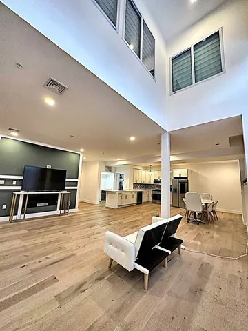 a living room with lots of furniture and a flat screen tv