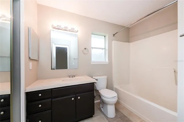 a bathroom with a sink a toilet and a bathtub