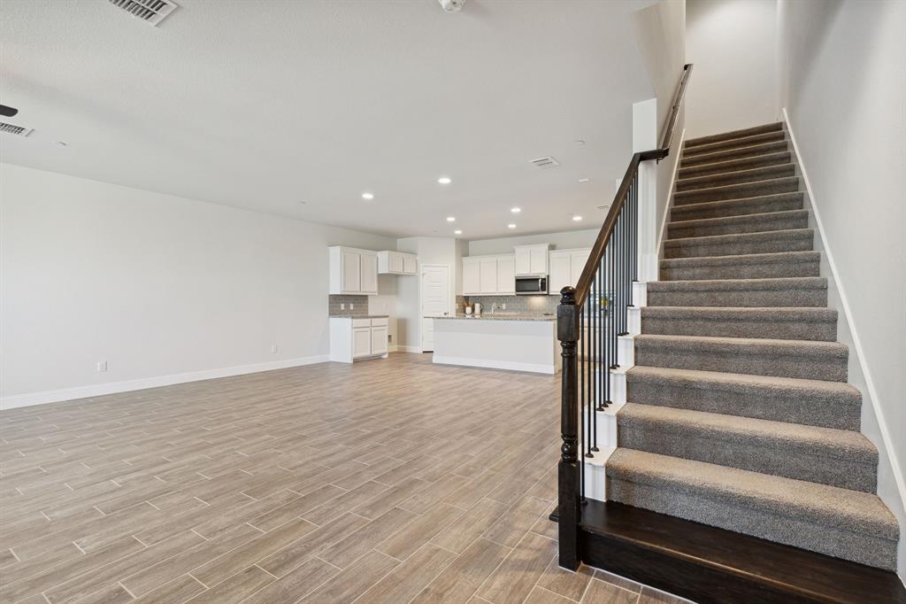 6028 Bursey Road Watauga, TX 76148 - Photo 7 of 27 a view of staircase with white walls