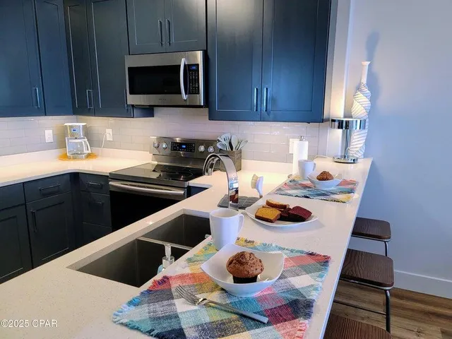 a kitchen with a sink and cabinets