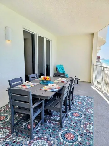a view of a dining table and chairs in a room