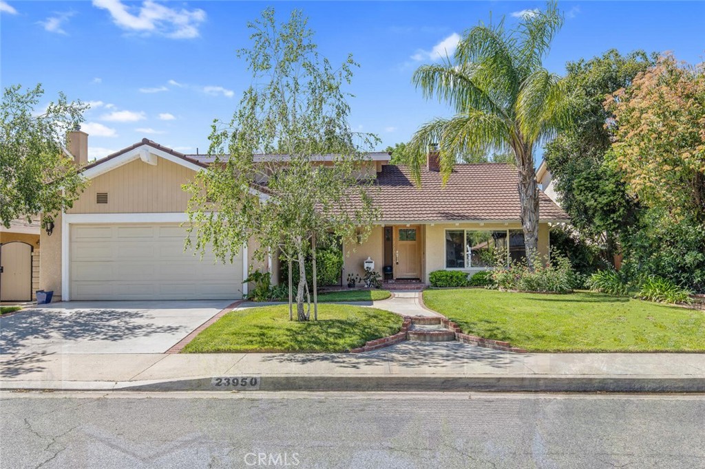 23950 Avenida Crescenta Valencia, CA 91355 - Photo 1 of 44 a front view of a house with a yard