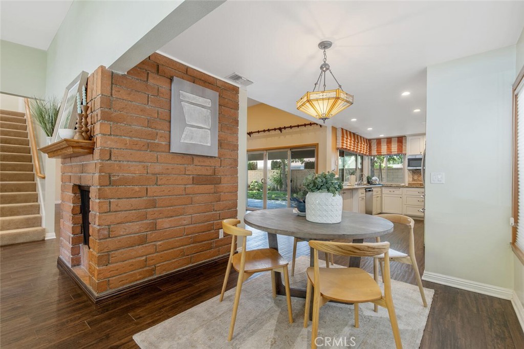 23950 Avenida Crescenta Valencia, CA 91355 - Photo 14 of 44 a view of a dining room with furniture window and wooden floor