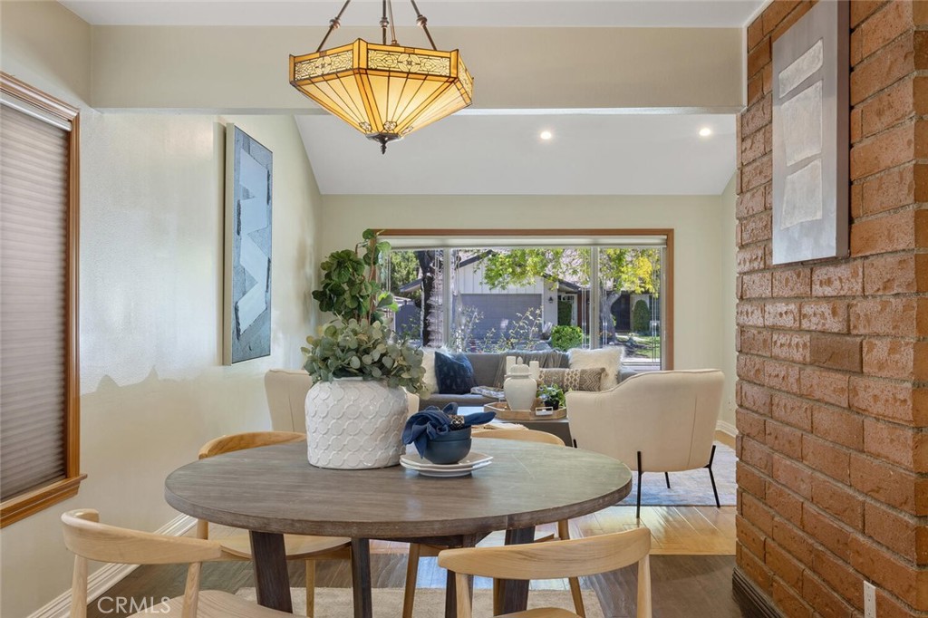 23950 Avenida Crescenta Valencia, CA 91355 - Photo 18 of 44 a view of a dining room with furniture and chandelier