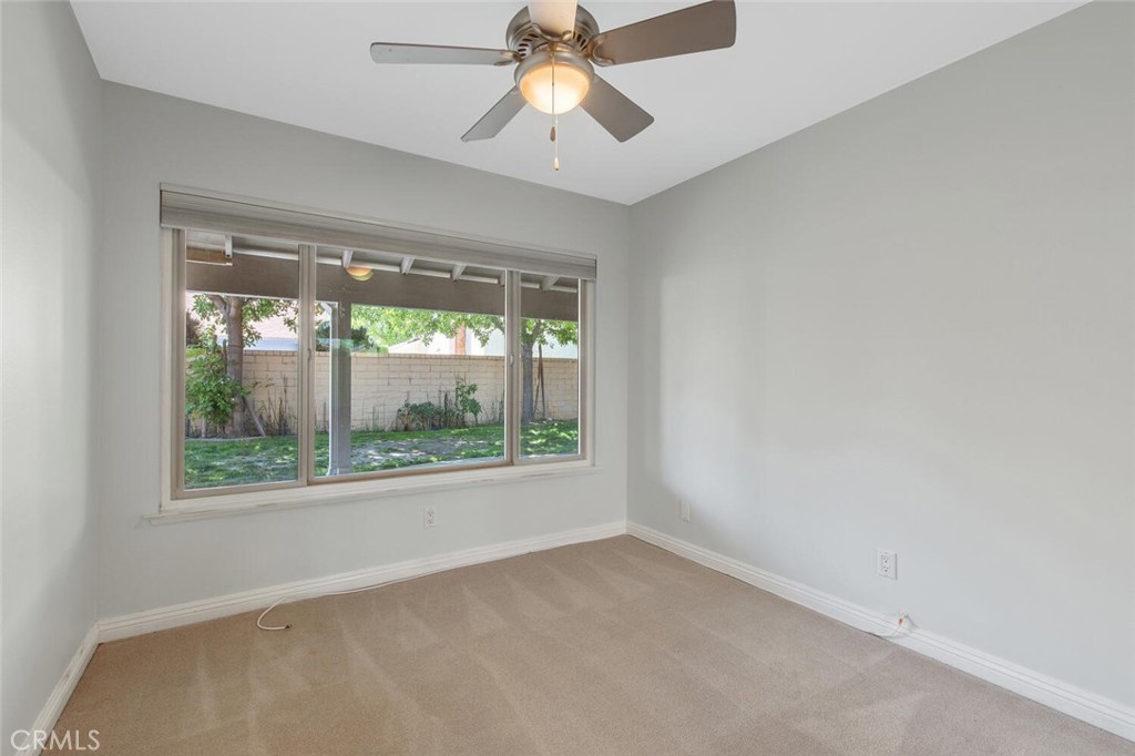 23950 Avenida Crescenta Valencia, CA 91355 - Photo 20 of 44 an empty room with window a ceiling fan and window