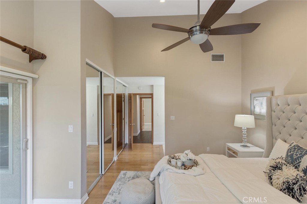 23950 Avenida Crescenta Valencia, CA 91355 - Photo 26 of 44 a bedroom with a bed and a ceiling fan