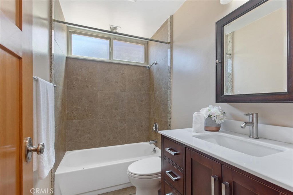 23950 Avenida Crescenta Valencia, CA 91355 - Photo 30 of 44 a bathroom with a sink a toilet and shower