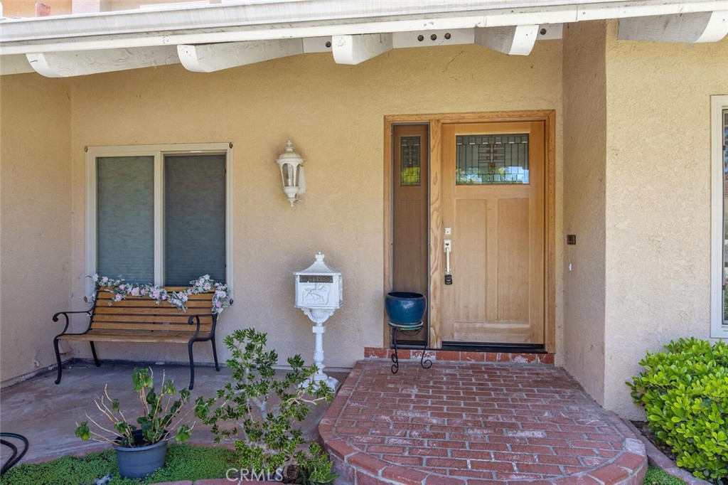 23950 Avenida Crescenta Valencia, CA 91355 - Photo 3 of 44 a view of a entryway door front of house