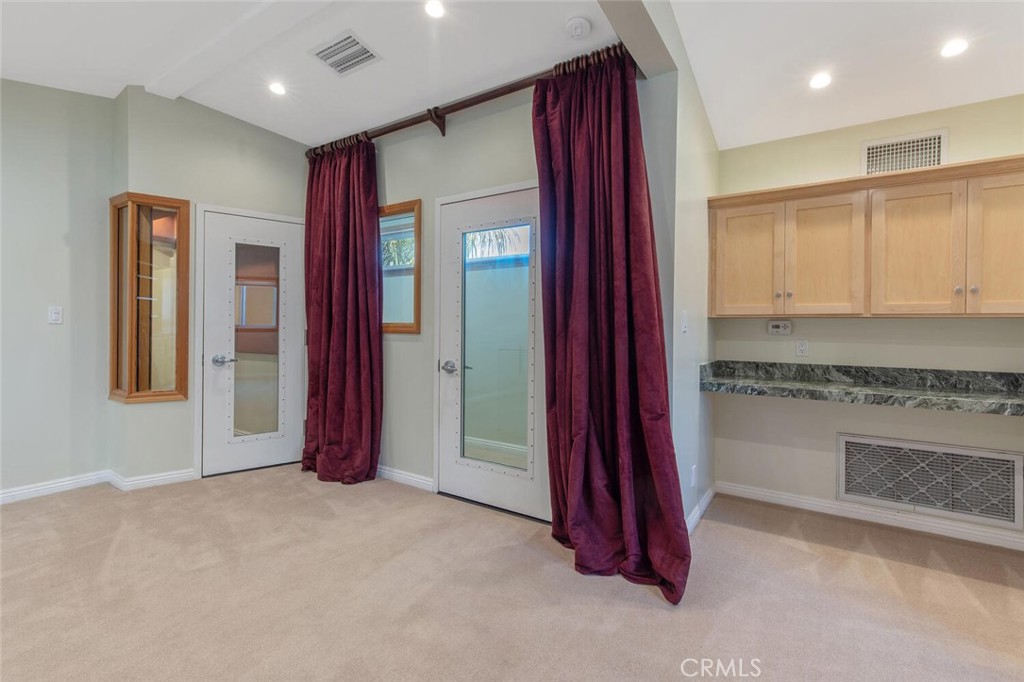 23950 Avenida Crescenta Valencia, CA 91355 - Photo 34 of 44 a view of a kitchen with a refrigerator and a stove top oven