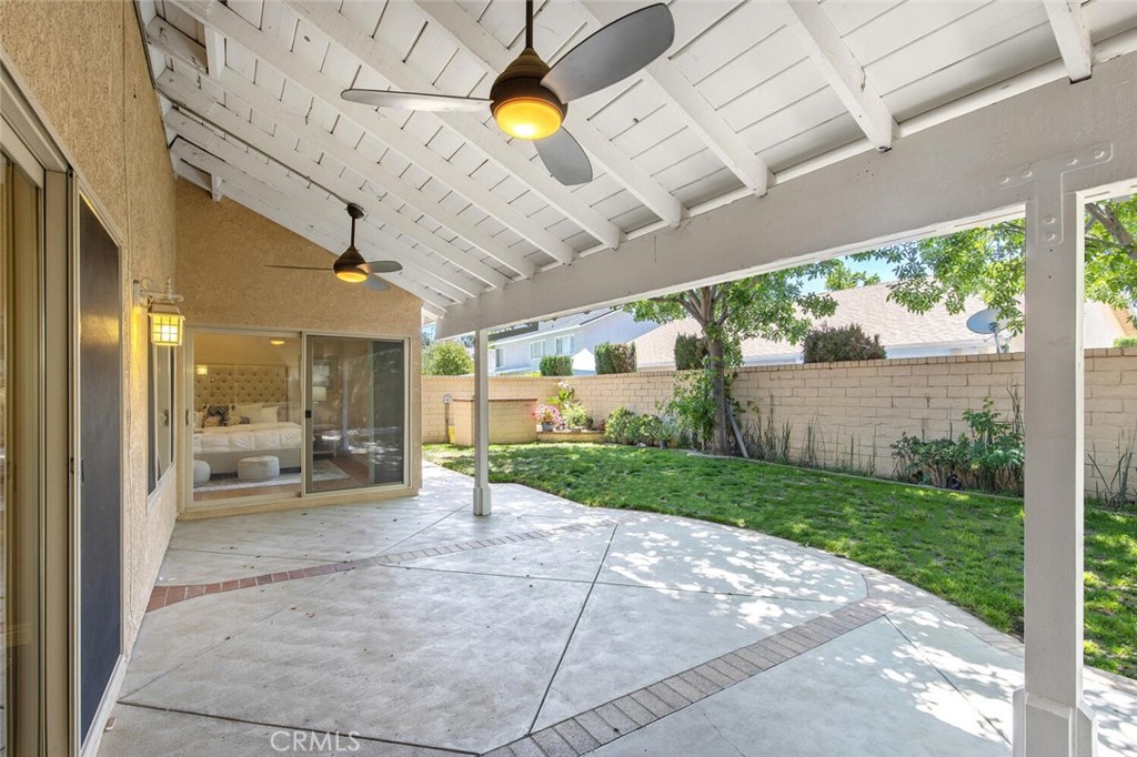23950 Avenida Crescenta Valencia, CA 91355 - Photo 37 of 44 a view of a patio with table and chairs and a big yard