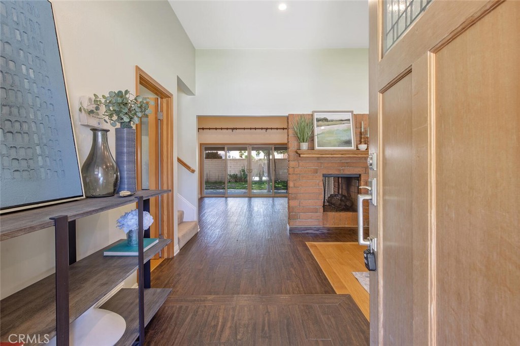 23950 Avenida Crescenta Valencia, CA 91355 - Photo 4 of 44 a view of a hallway with furniture and wooden floor