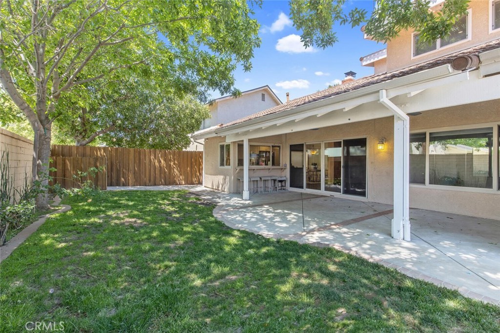 23950 Avenida Crescenta Valencia, CA 91355 - Photo 42 of 44 front view of a house with a yard