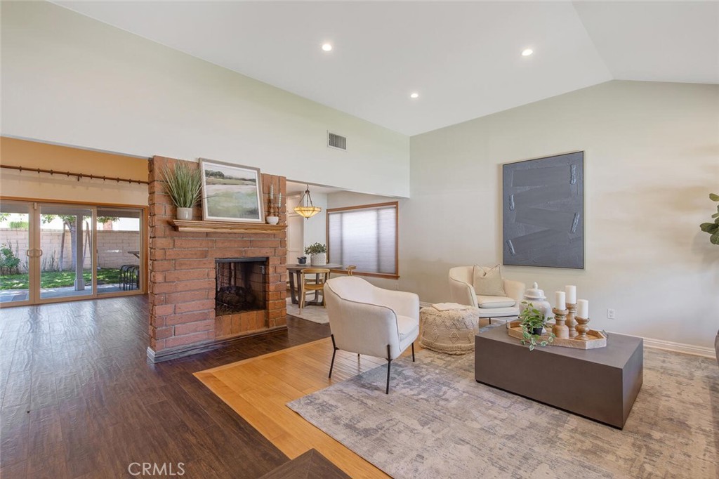 23950 Avenida Crescenta Valencia, CA 91355 - Photo 5 of 44 a living room with furniture and a fireplace