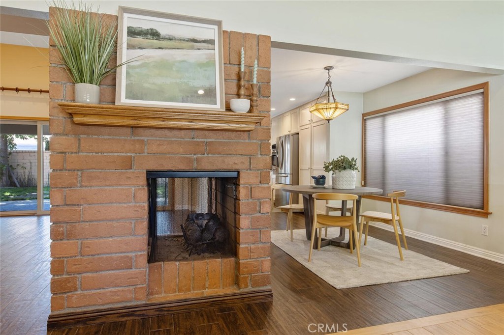 23950 Avenida Crescenta Valencia, CA 91355 - Photo 10 of 44 a dining room with fireplace and window