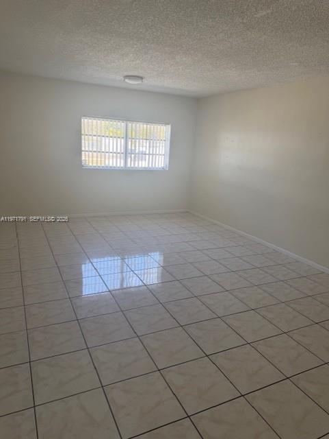 11000 Southwest 176th Street Miami, FL 33157 - Photo 11 of 13 an empty room with windows