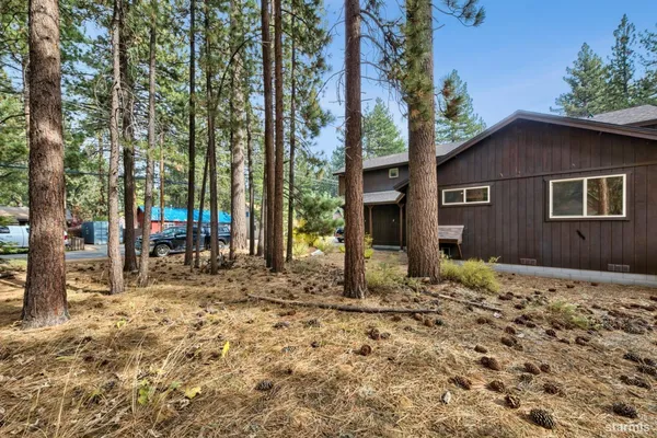 a house with trees in the background