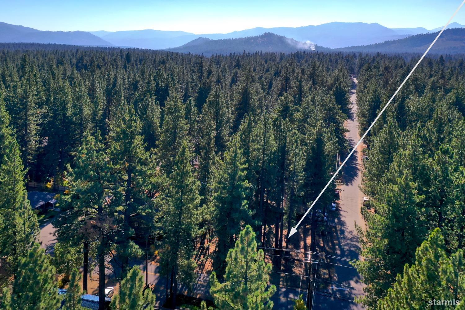 1124 Martin Avenue South Lake Tahoe, CA 96150 - Photo 2 of 16 a view of a house with a mountain in the background