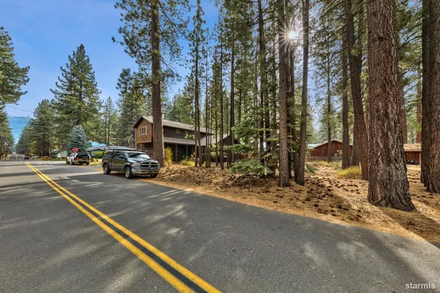 a view of street with parked cars