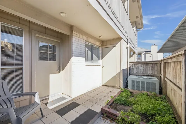 a view of balcony with wooden floor and fence