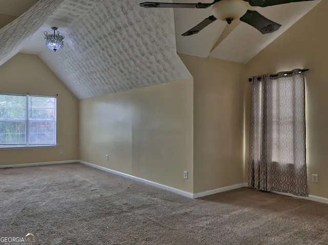 a white bath tub sitting next to a window