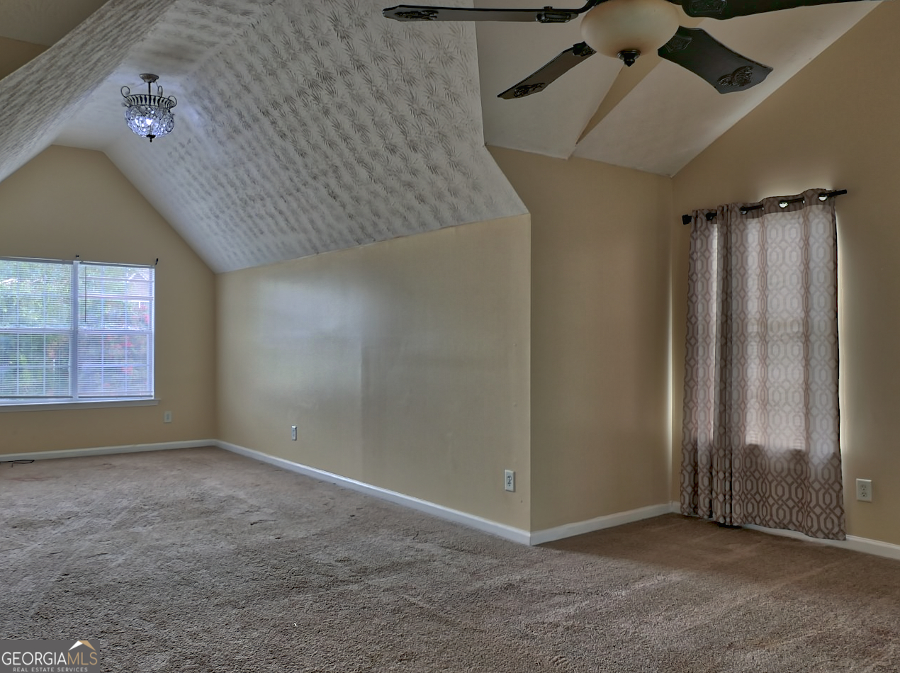 512 Chaucer Way Stockbridge, GA 30281 - Photo 16 of 25 an empty room with windows