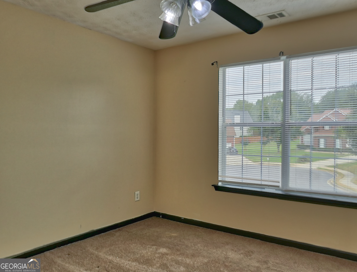 512 Chaucer Way Stockbridge, GA 30281 - Photo 22 of 25 an empty room with a window