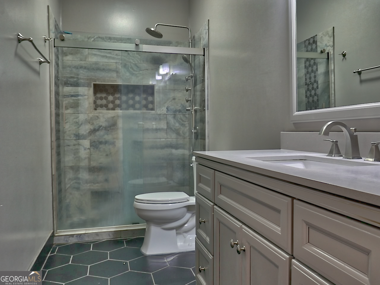512 Chaucer Way Stockbridge, GA 30281 - Photo 24 of 25 a bathroom with a sink toilet and shower