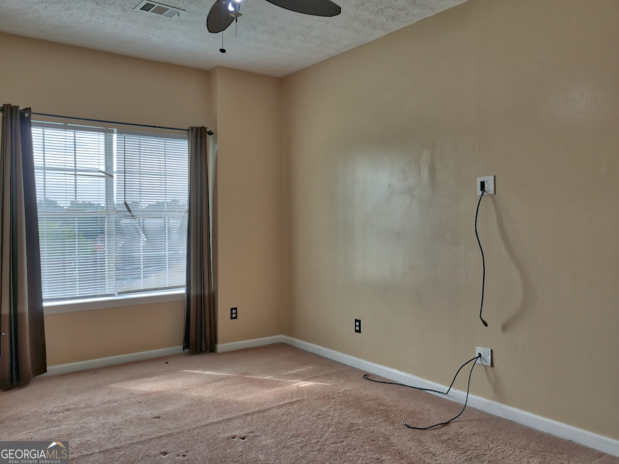 512 Chaucer Way Stockbridge, GA 30281 - Photo 25 of 25 a view of an empty room with a window