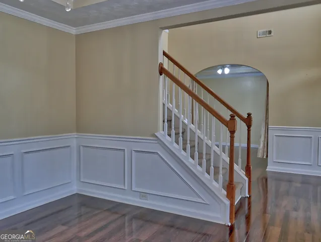 a view of an entryway with wooden floor