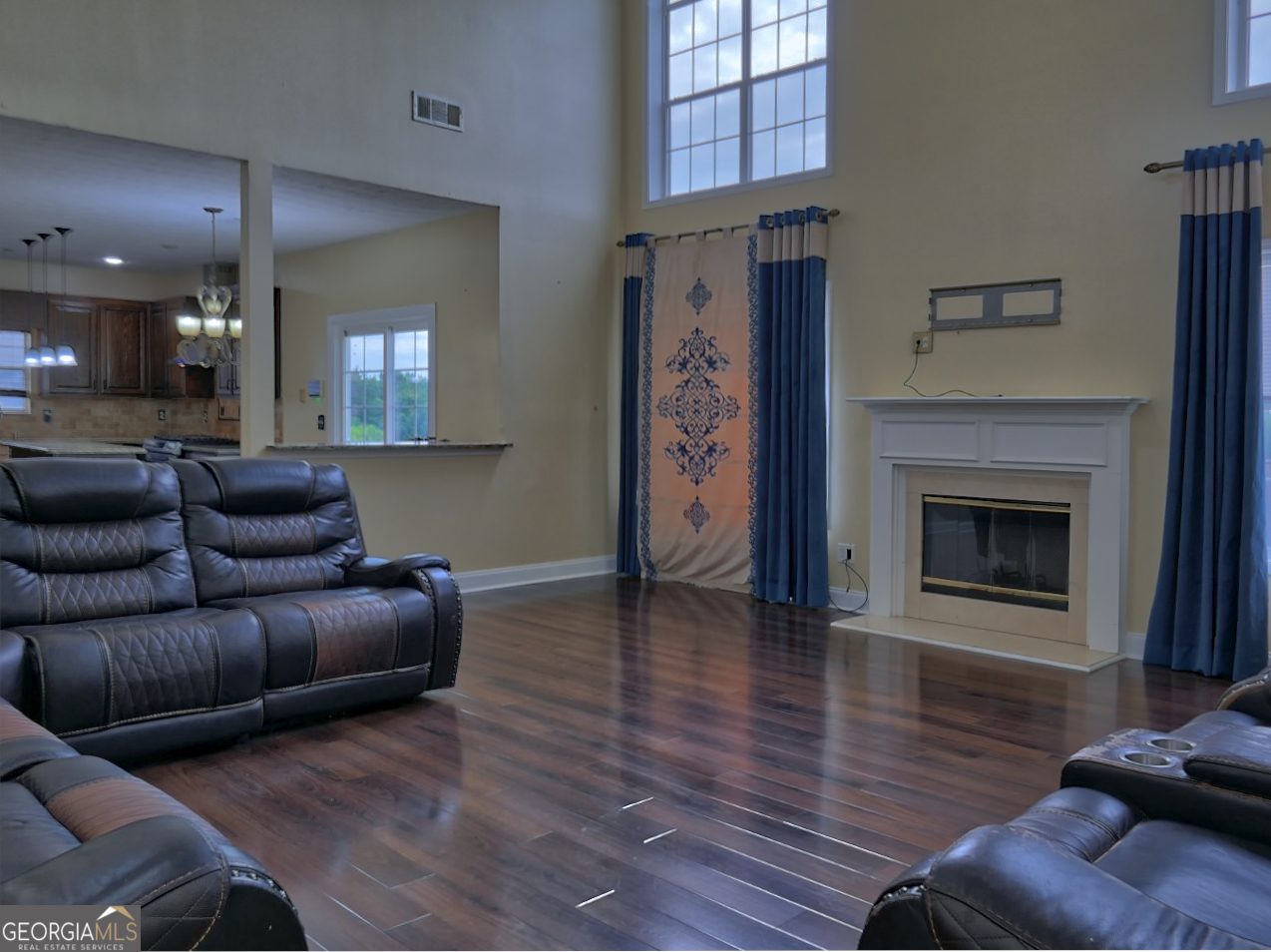 512 Chaucer Way Stockbridge, GA 30281 - Photo 8 of 25 a living room with furniture and a fireplace