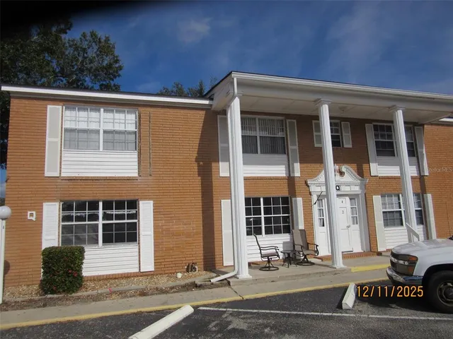 a view of a house with a door and a window