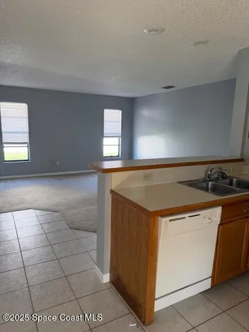 a kitchen with a stove and a sink