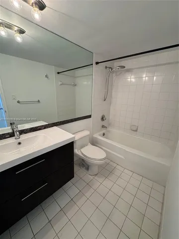 a bathroom with a sink a toilet and a bathtub