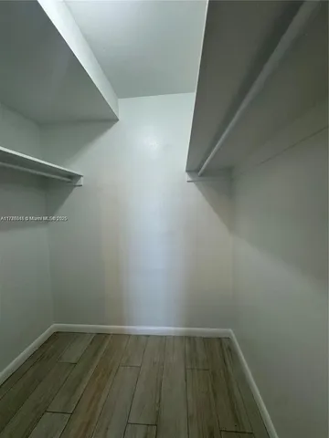 a view of an empty walk in closet