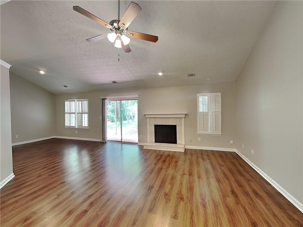 3828 Windmill Circle Rex, GA 30273 - Photo 2 of 17 a view of empty room with wooden floor and fan