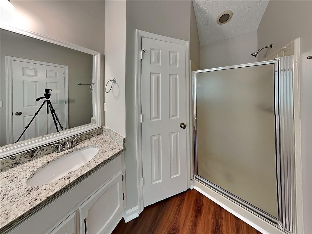 3828 Windmill Circle Rex, GA 30273 - Photo 10 of 17 a bathroom with a granite countertop sink mirror and double