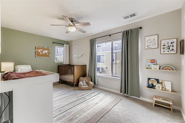 a room with a bed and a chandelier