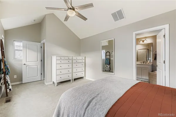 a bedroom with a bed and a bathroom