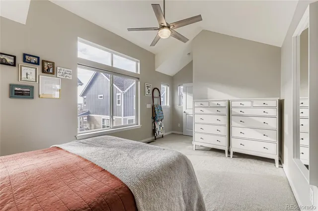 a bedroom with a bed dresser and a window