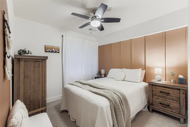 a bedroom with a bed and a closet