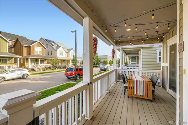 a view of a balcony with wooden floor and outdoor space