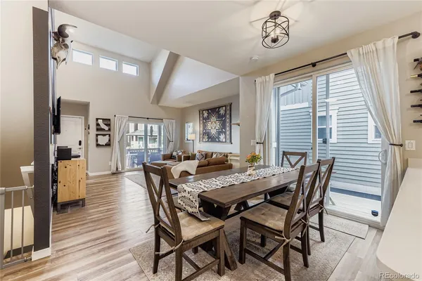 a view of a dining room with furniture and window
