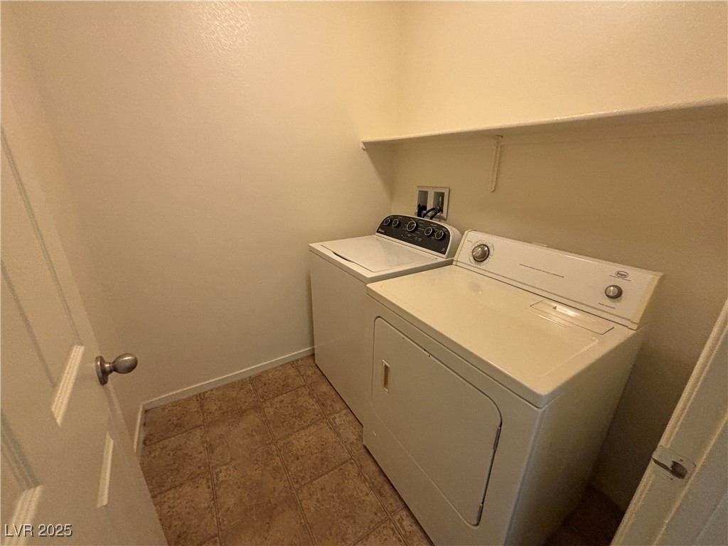 4512 Townwall Street Las Vegas, NV 89115 - Photo 14 of 56 Washroom featuring baseboards and washing machine and dryer
