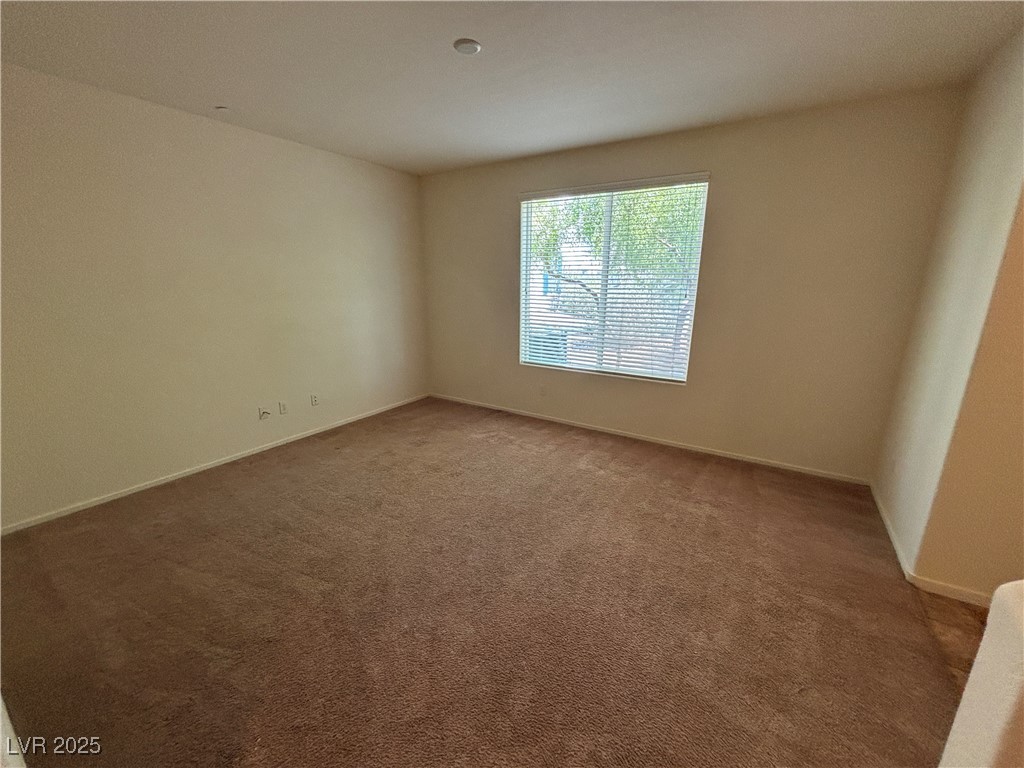 4512 Townwall Street Las Vegas, NV 89115 - Photo 15 of 56 Unfurnished room featuring carpet and baseboards