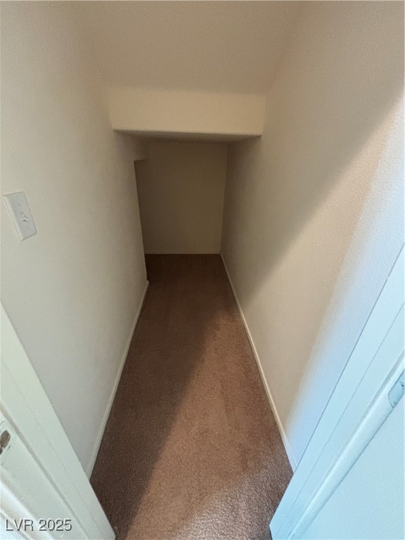 4512 Townwall Street Las Vegas, NV 89115 - Photo 16 of 56 Hallway with carpet flooring and baseboards