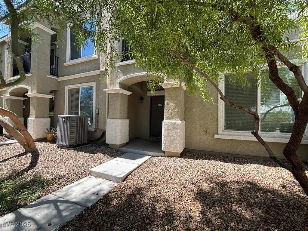 4512 Townwall Street Las Vegas, NV 89115 - Photo 2 of 56 Doorway to property with stucco siding